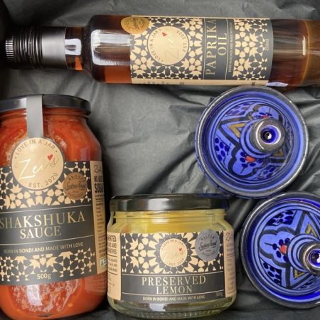 "Zee's Love in a Jar gift box with Shakshuka sauce, preserved lemon, paprika oil, and two decorative tagines – a perfect gift for food lovers."